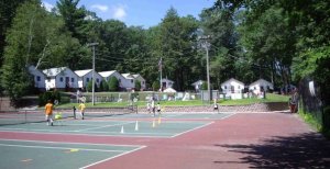 Tennis Courts with the Girls Bunks in the background
